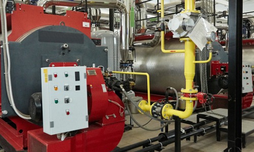 A modern boiler in a boiler room after Boiler Replacement in Illinois